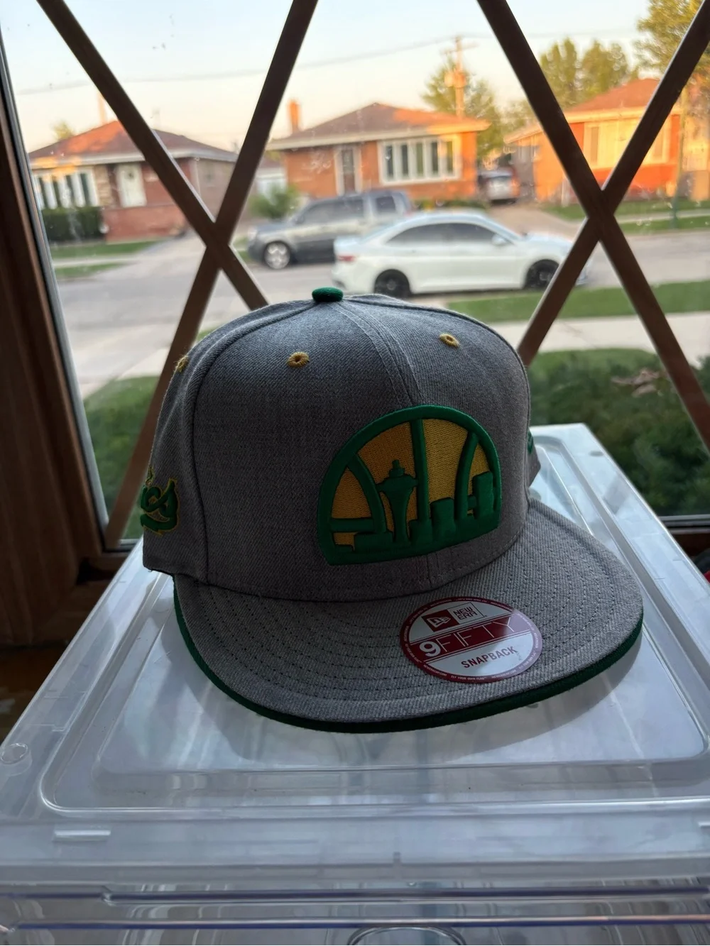 New Era Gray Snapback Hat with Green and Yellow Seattle Skyline Patch